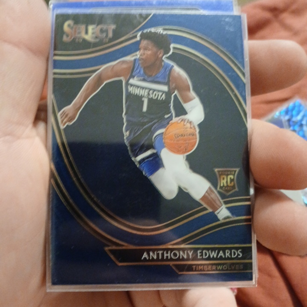 Anthony Edward rookie card and luka doncic and Kristaps porzingis mosaic cards